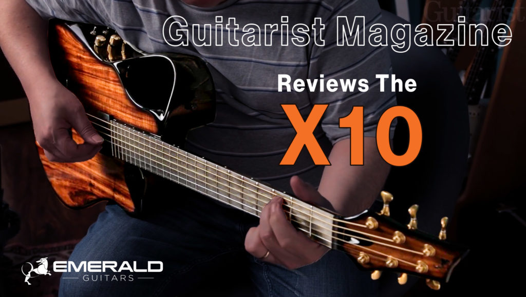 Musician demonstrating the X10 Artisan Woody guitar in Guitarist Magazine review