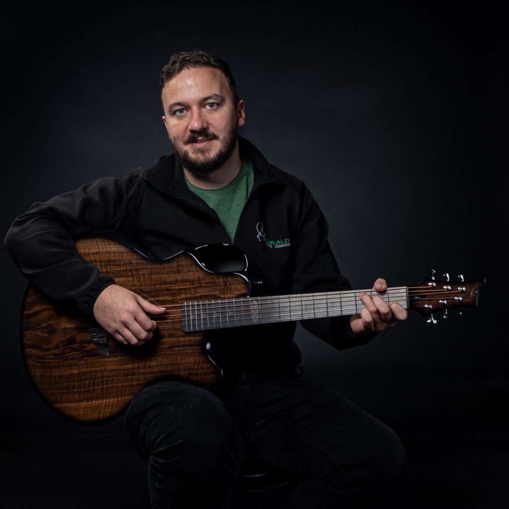 Kevin Quigley with an Emerald Guitar