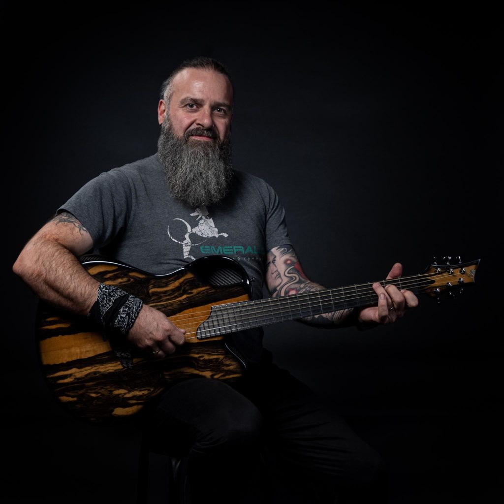 Musician Davy Kerrigan with Emerald Guitar