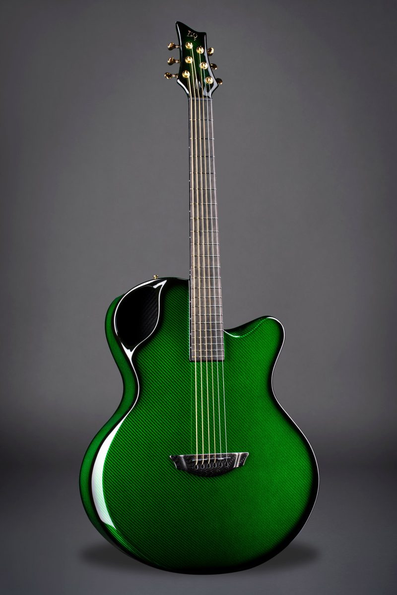 Vivid green Emerald X30 guitar with carbon fiber pattern accentuating modern acoustic design