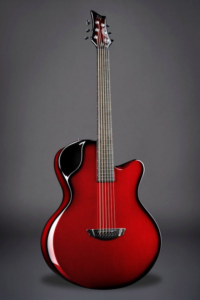 Striking red Emerald X30 acoustic guitar with a carbon weave pattern, blending aesthetics and modern technology