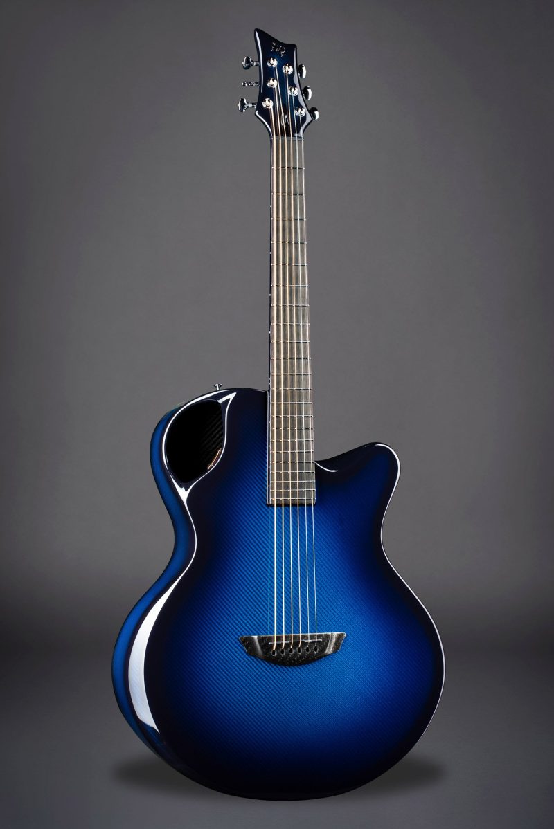 The Emerald X30 in stunning vibrant blue, showcasing cutting-edge carbon fiber design for optimal acoustic performance.