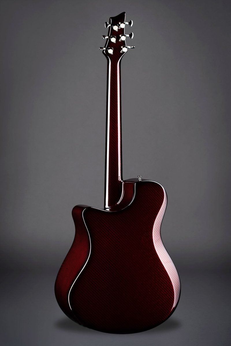 Rear view of Emerald X10 carbon fiber guitar in deep red finish