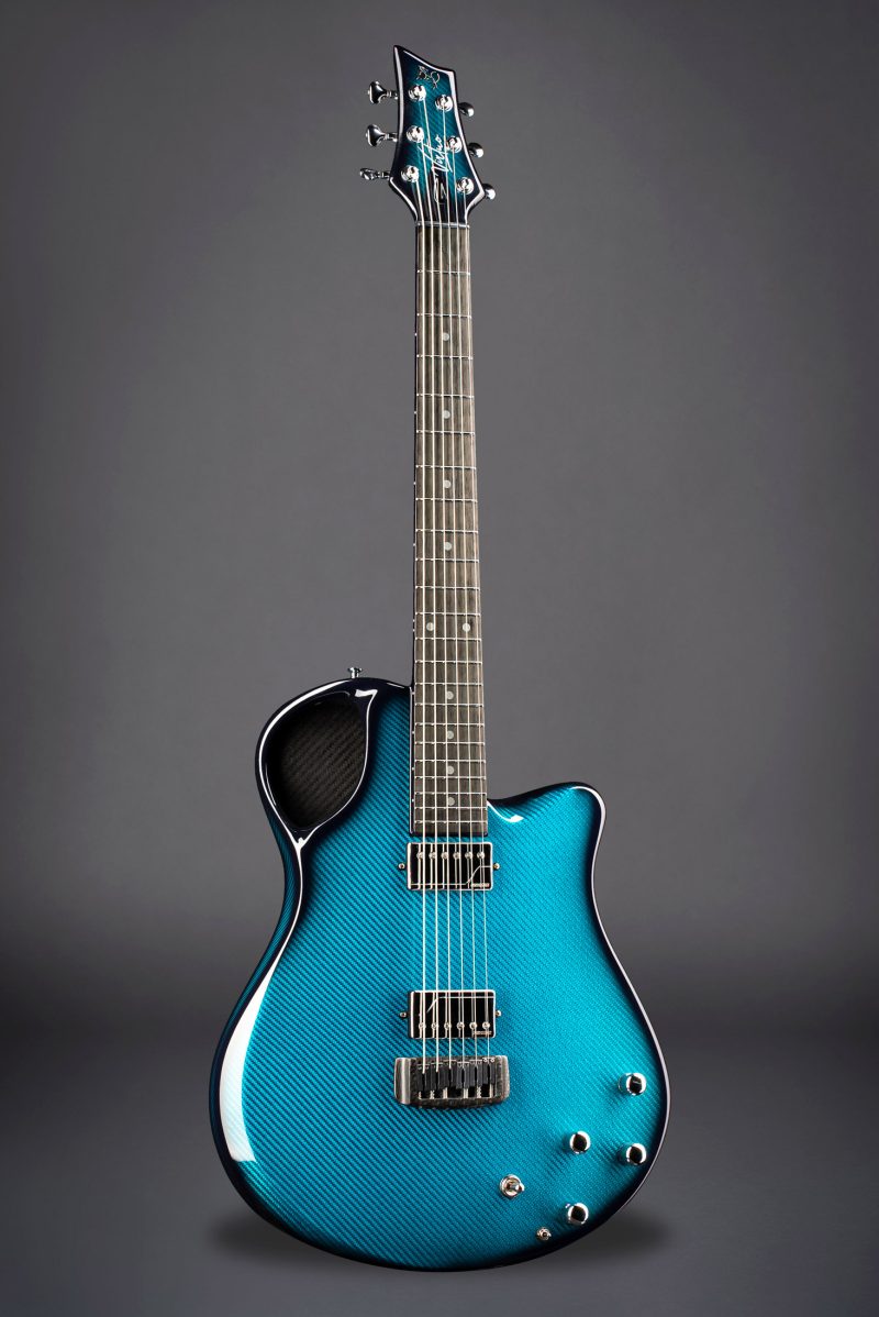 High-quality Emerald Virtuo electric guitar with teal finish and ergonomic neck design