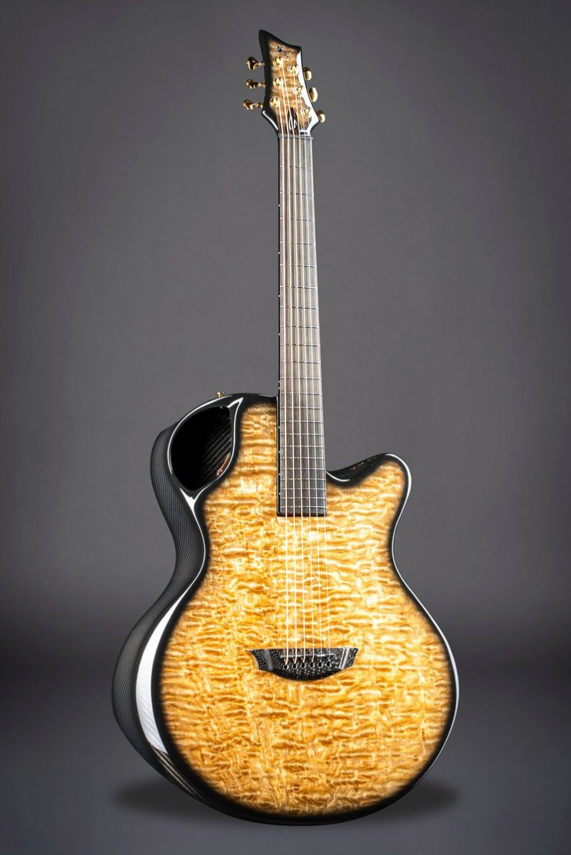 High-contrast X30 Tamo Ash guitar against black background