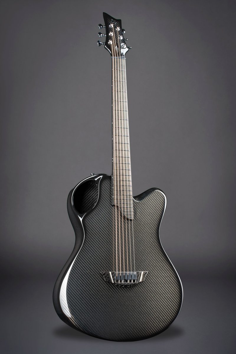 X20 Black carbon fiber guitar silhouette against dark background