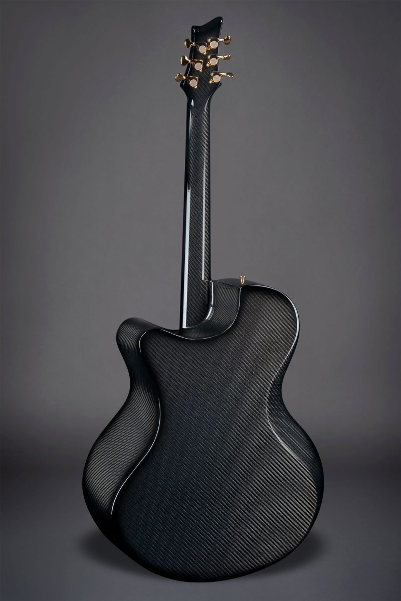 X30 Black carbon fiber guitar rear view against black background