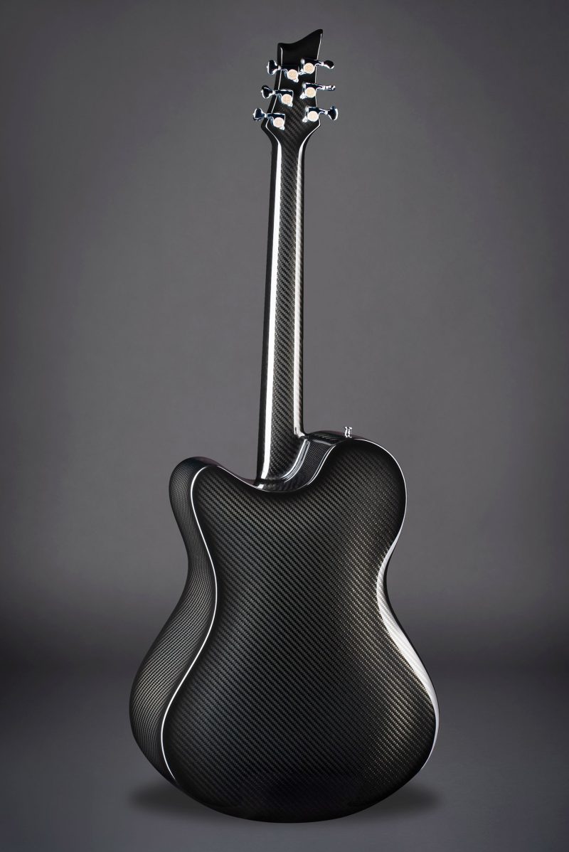 Rear view of X20 Black carbon fiber guitar on black background