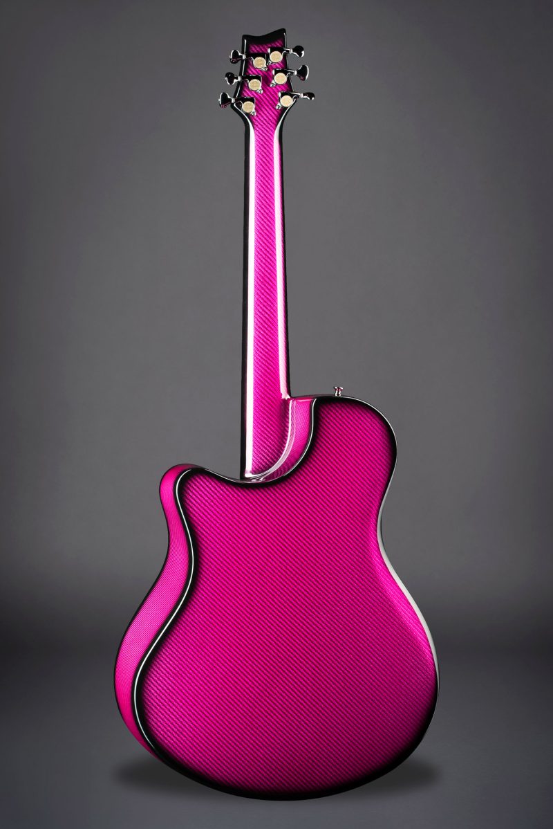 Rear view of Emerald X7 carbon fiber guitar in vibrant pink