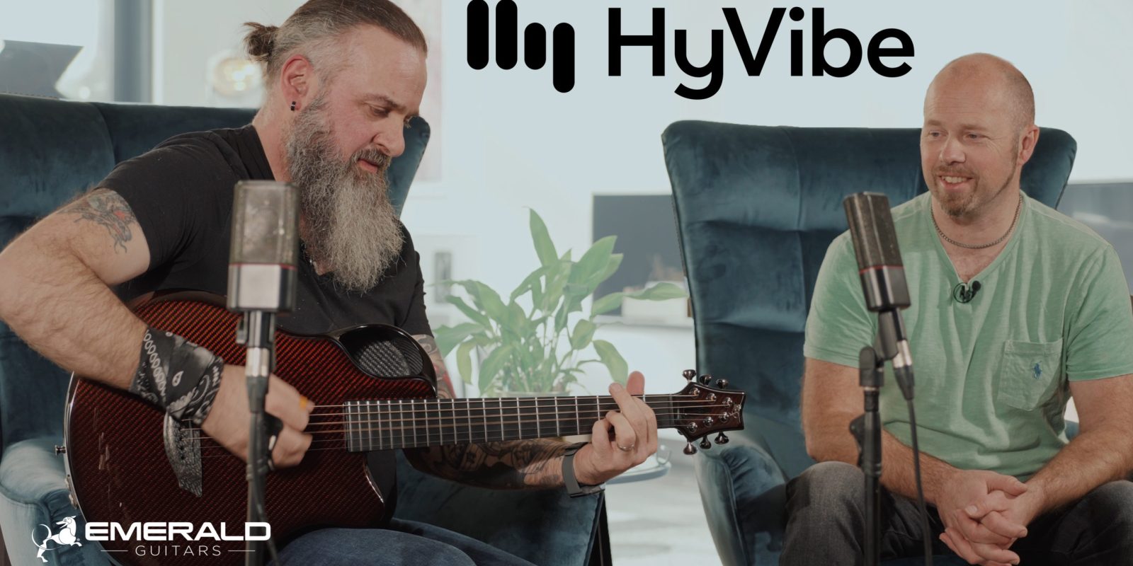 Musicians discussing Emerald's HyVibe System on guitar